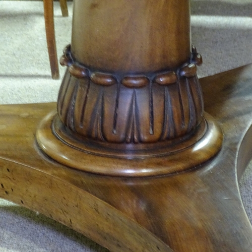 261 - A William IV circular mahogany tilt-top dining table, on tulip carved centre column, and shaped plat... 