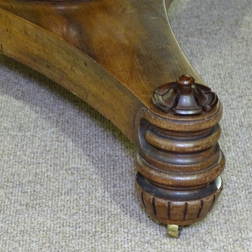 261 - A William IV circular mahogany tilt-top dining table, on tulip carved centre column, and shaped plat... 