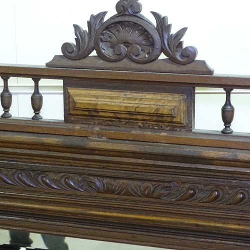 268 - A 19th century French carved oak-framed wall mirror, with fluted columns, height 4'6