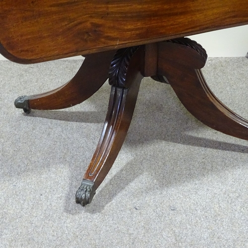 277 - A George IV mahogany drop leaf breakfast table, on quadruple base