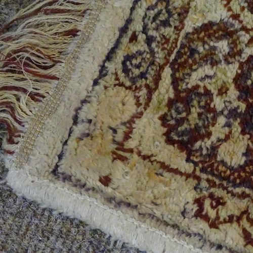 280 - A large oriental silk rug, with exotic bird decoration