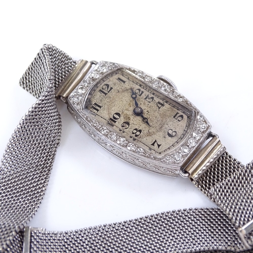 303 - An Art Deco lady's platinum and diamond cocktail wristwatch, by Goldsmiths and Silversmiths Co Ltd, ... 