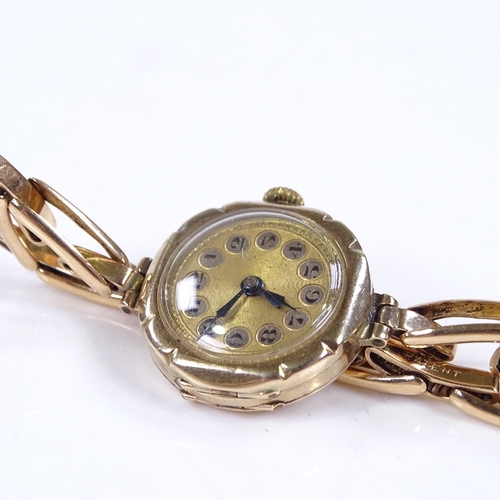 310 - A Vintage lady's 9ct gold mechanical wristwatch, gilded dial with Deco Arabic numerals and blued ste... 