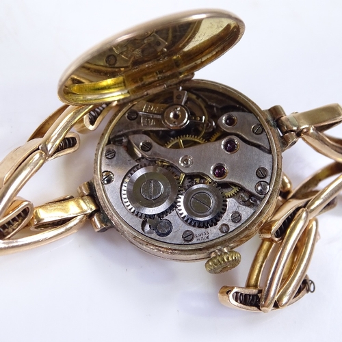 310 - A Vintage lady's 9ct gold mechanical wristwatch, gilded dial with Deco Arabic numerals and blued ste... 