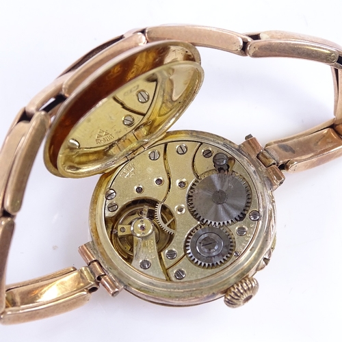 315 - A 9ct gold half hunter mechanical wristwatch, with enamel chapter dial, Arabic numerals, and 9ct exp... 