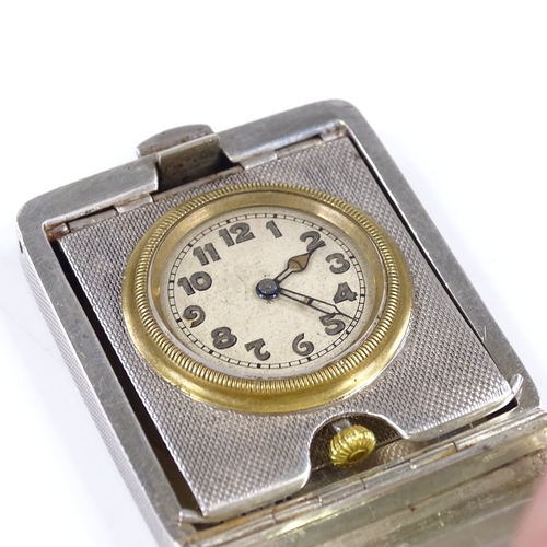 323 - An Art Deco silver-cased travelling timepiece, engine turned case, with Arabic numerals and blued st... 