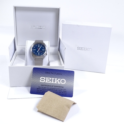 324 - SEIKO - a stainless steel 100M automatic wristwatch, blue dial with luminous hour markers and day/da... 