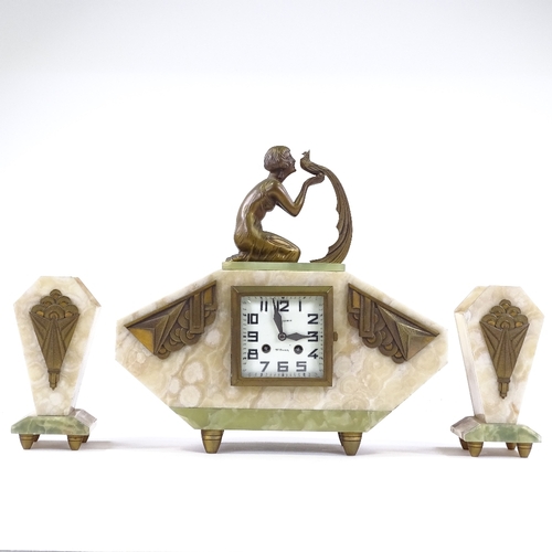 345 - A French Art Deco alabaster and onyx-cased clock garniture, surmounted by a gilt-metal figure of a g... 