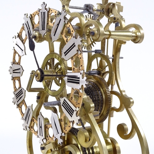 352 - A brass skeleton clock with single fusee chain-driven movement, white marble base, and silvered nume... 