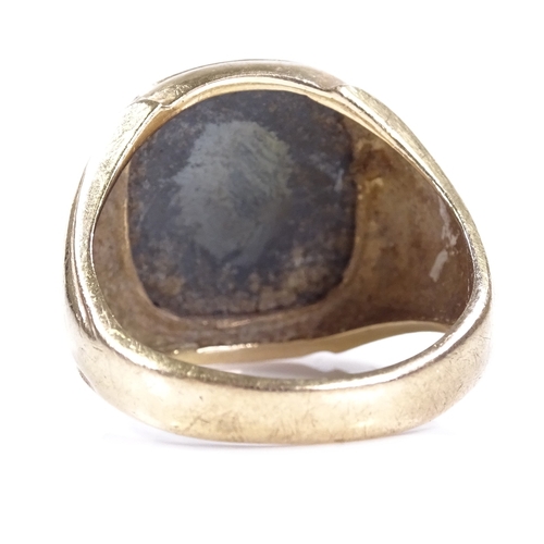 390 - A large 9ct gold carved intaglio haematite seal ring, depicting Centurion, setting height 18.7mm, si... 