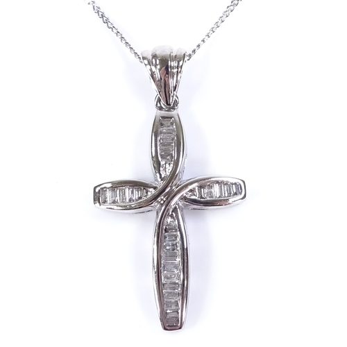 392 - A 9ct white gold baguette-cut diamond set cross pendant necklace, of stylised form, pendant height e... 