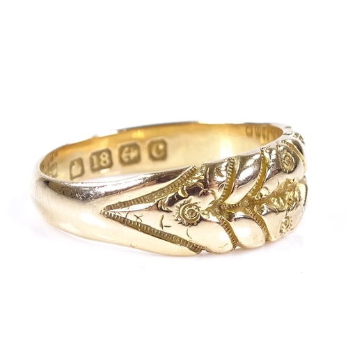 396 - An 18ct gold band ring, with engraved floral decoration, maker's marks KBSP, band width 6.9mm, size ... 