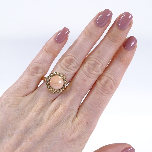 398 - An unmarked gold coral and split-pearl cluster ring, with pierced bridge and closed back setting, se... 