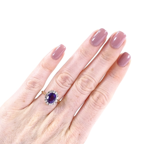 401 - A 9ct gold oval-cut amethyst and diamond cluster ring, setting height 13mm, size L, 3.3g