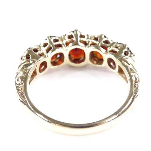 402 - A 9ct gold 5-stone garnet half-hoop ring, with engraved shoulders and pierced bridge, setting height... 