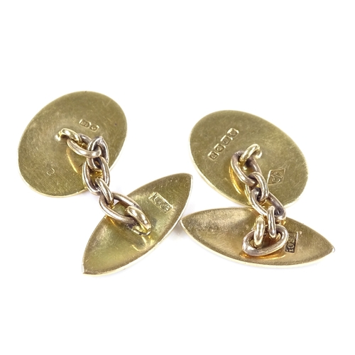 404 - A pair of 18ct gold green and white enamel cufflinks, by Owen Powell, hallmarks Birmingham 1930, mar... 