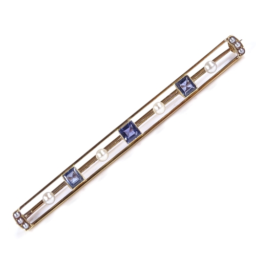 409 - An Edwardian 15ct gold sapphire and pearl bar brooch, openwork settings with 3 square-cut sapphires,... 