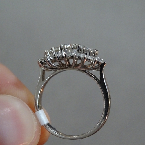 412 - An 18ct white gold diamond triple cluster ring, total diamond content approx 1.5ct, setting height 1... 