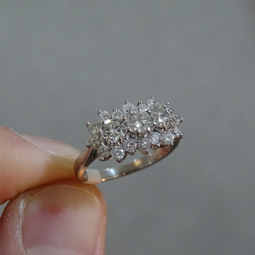 412 - An 18ct white gold diamond triple cluster ring, total diamond content approx 1.5ct, setting height 1... 