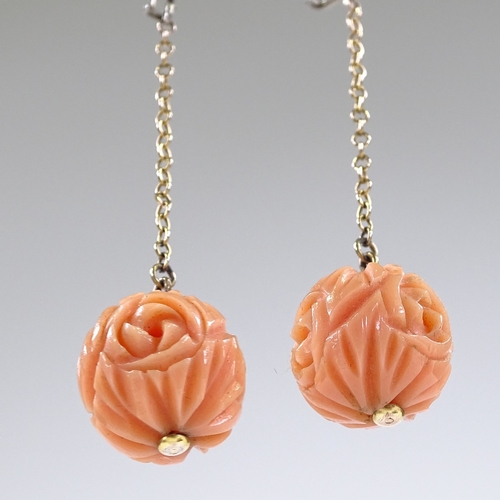 422 - A pair of floral carved coral drop earrings, unmarked silver shepherd hook fittings, coral diameter ... 