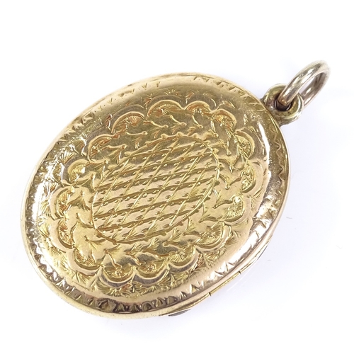 424 - A Victorian 9ct gold locket pendant, with intaglio carved shield-shaped sardonyx seal, within a flor... 