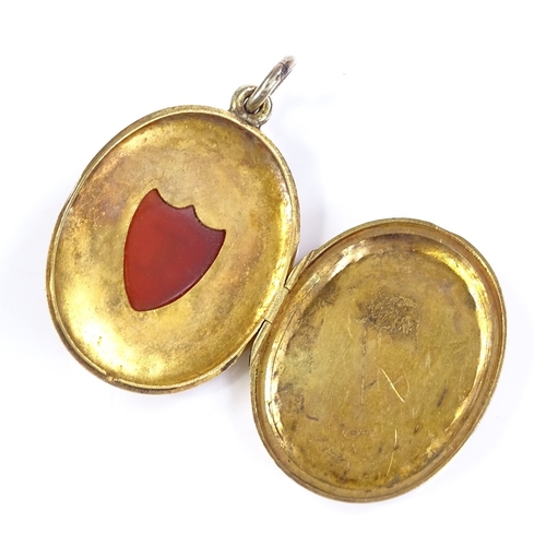 424 - A Victorian 9ct gold locket pendant, with intaglio carved shield-shaped sardonyx seal, within a flor... 