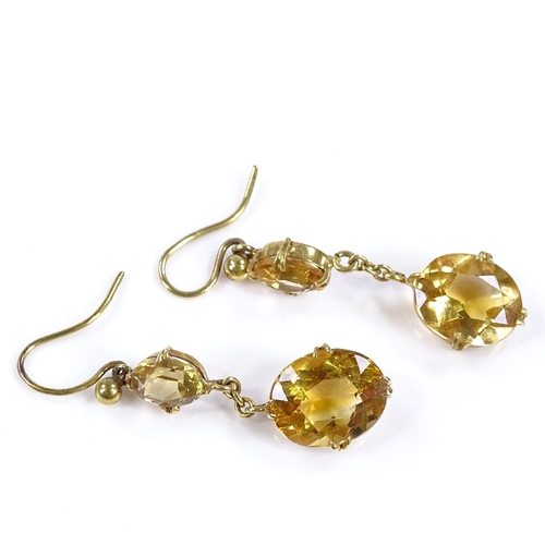 433 - A pair of unmarked gold 2-stone citrine drop earrings, with shepherd hook fittings, height excluding... 