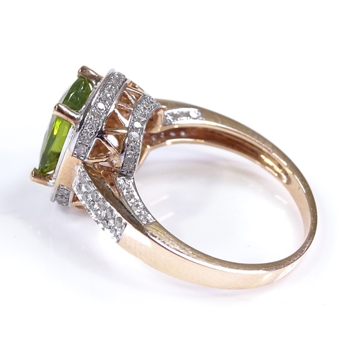 451 - A 14ct rose gold peridot and diamond dress ring, with diamond set shoulders and bridge, setting heig... 