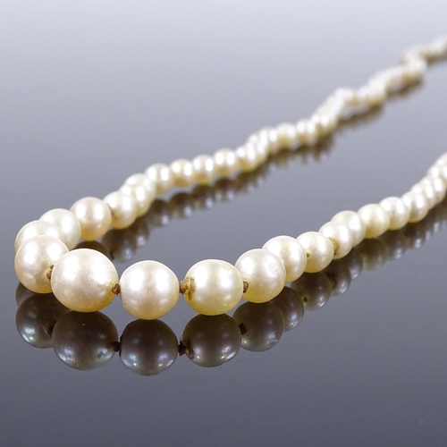 457 - A graduated single strand matinee pearl necklace, with unmarked gold rose-cut diamond set clasp, lar... 