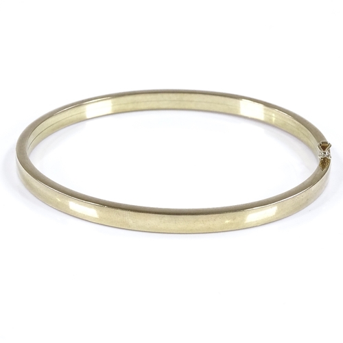 458 - A German 8ct gold bangle, band width 4.7mm, internal diameter 66mm, internal height 59mm, 8.3g