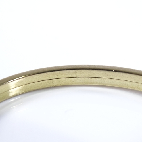 458 - A German 8ct gold bangle, band width 4.7mm, internal diameter 66mm, internal height 59mm, 8.3g