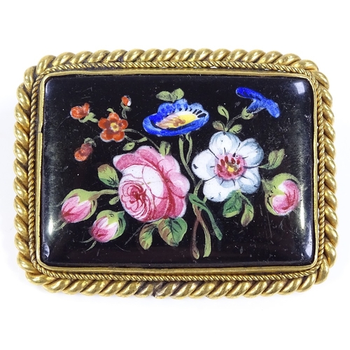 466 - A rectangular floral painted porcelain panel brooch, in unmarked yellow metal rope twist frame, broo... 