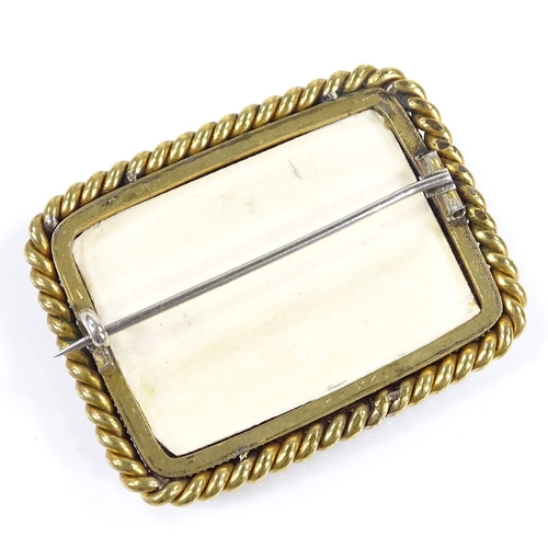 466 - A rectangular floral painted porcelain panel brooch, in unmarked yellow metal rope twist frame, broo... 