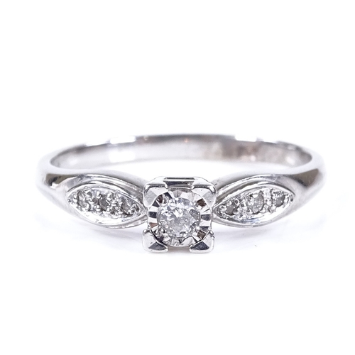 471 - A 9ct white gold solitaire diamond ring, with diamond set shoulders, total diamond content approx 0.... 