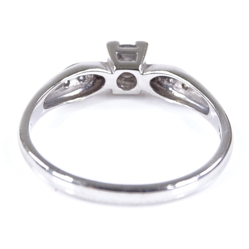 471 - A 9ct white gold solitaire diamond ring, with diamond set shoulders, total diamond content approx 0.... 