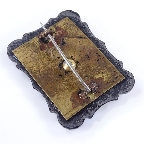 473 - A Victorian jet panel mourning brooch, with central crystal covered hair panel, brooch length 44.6mm... 