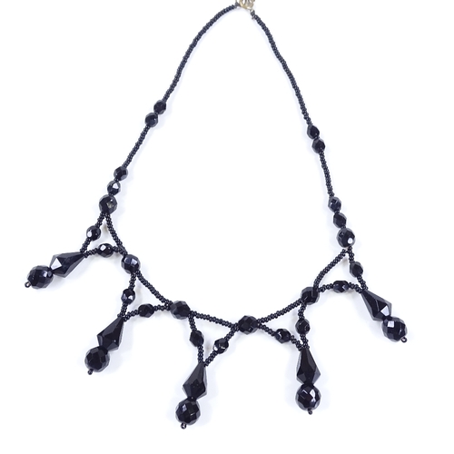 475 - A Victorian faceted jet festoon necklace, length 39cm