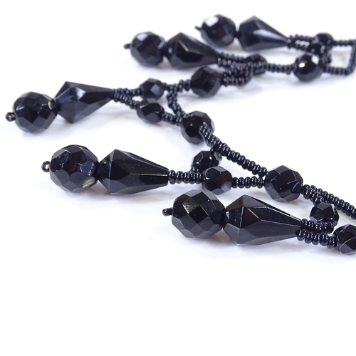 475 - A Victorian faceted jet festoon necklace, length 39cm