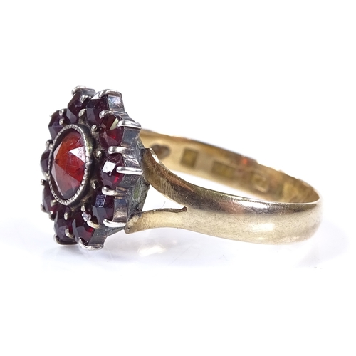 480 - An 18ct gold faceted garnet cluster ring, setting height 13.4mm, size S, 3.3g