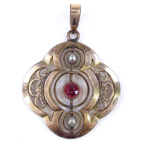 481 - An unmarked gold garnet and split-pearl pendant, openwork stylised settings, height excluding bale 2... 