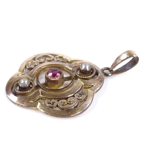 481 - An unmarked gold garnet and split-pearl pendant, openwork stylised settings, height excluding bale 2... 