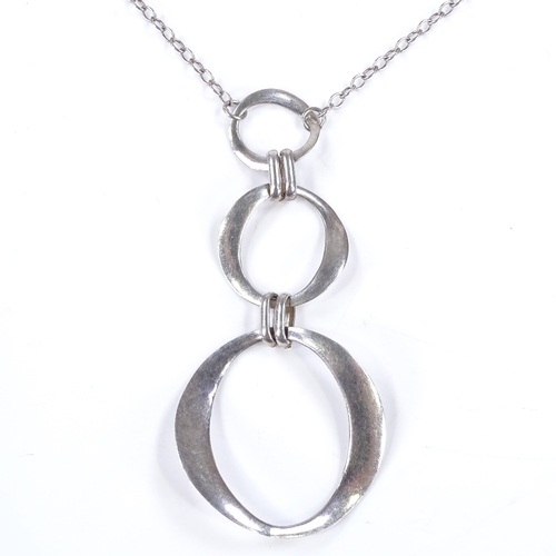 482 - A Finnish style sterling silver 3-section pendant necklace, of graduated circular form, maker's mark... 