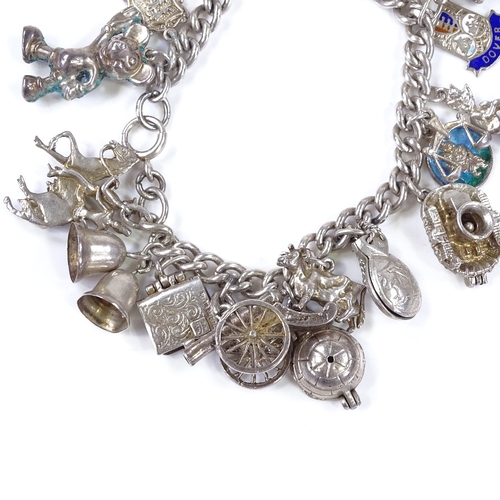 483 - A silver charm bracelet, with various charms, 66.9g