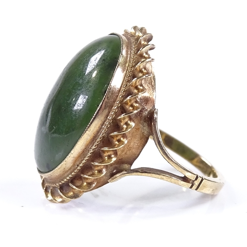 492 - A 9ct gold oval green stone dress ring, with rope twist surround, setting height 22.8mm, size J, 4.8... 