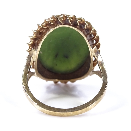 492 - A 9ct gold oval green stone dress ring, with rope twist surround, setting height 22.8mm, size J, 4.8... 