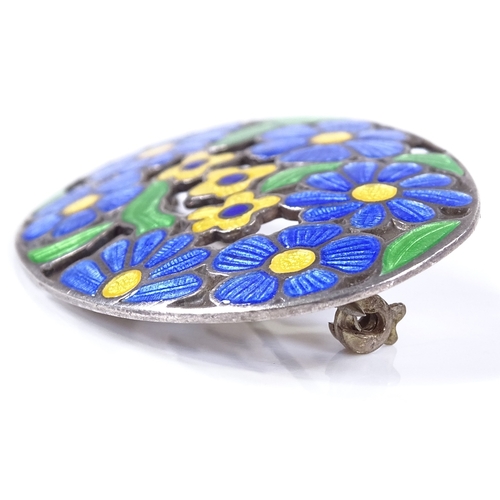 493 - An Arts and Crafts silver and coloured enamel oval brooch, with floral decoration, maker's marks D a... 