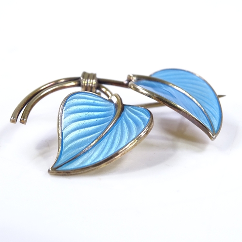 497 - A Norwegian sterling silver gilt and blue enamel leaf brooch, by Hans Myhre of Oslo, length 36.9mm, ... 