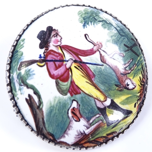 500 - A late Georgian painted enamel hunting brooch, depicting game hunter with dog, unmarked silver frame... 