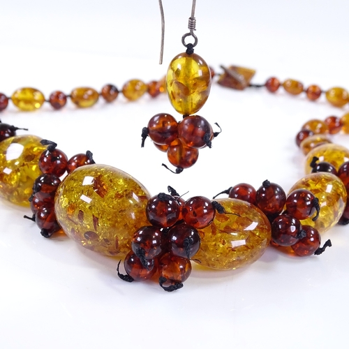 504 - An amber bead necklace, together with a matching pair of earrings (2)