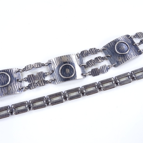 516 - A silver 4-section abstract bracelet, length 20cm, together with a silver niello gate link bracelet,... 